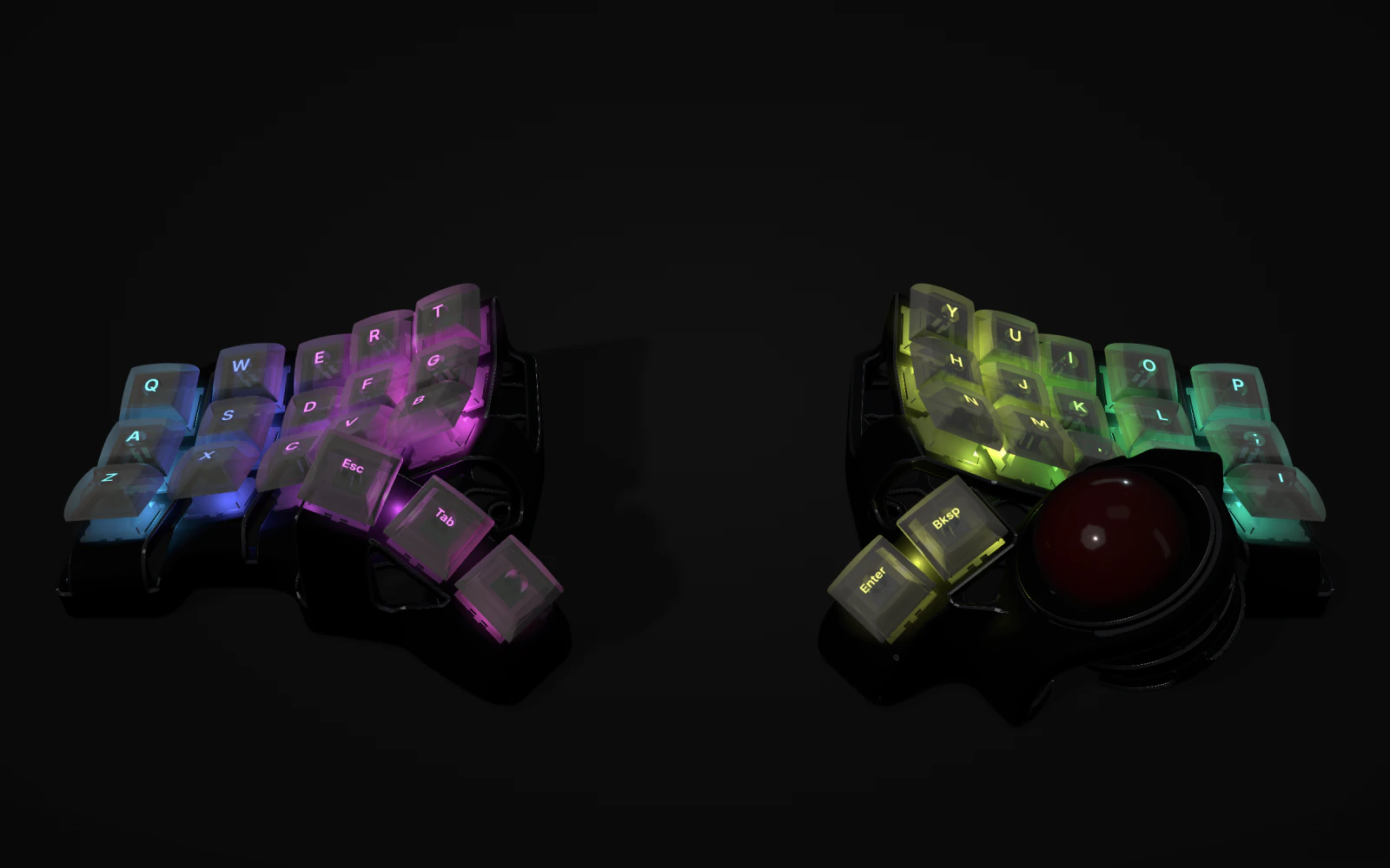 A split keyboard with a red trackball in a black case, clear keycaps lit from below in a rainbow running from blue through violet to green.