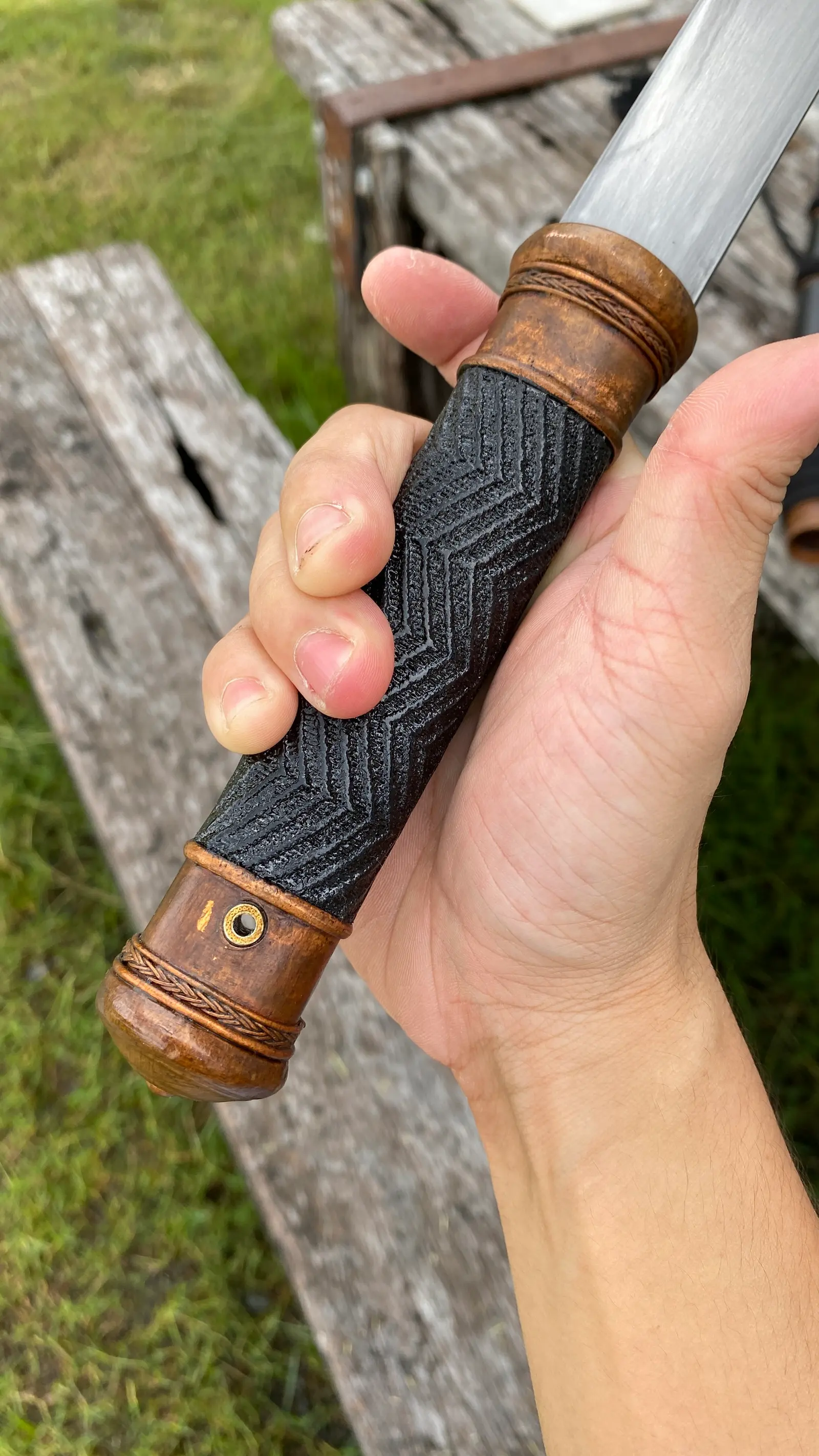 The grip held from the other side, showing the copper collar.