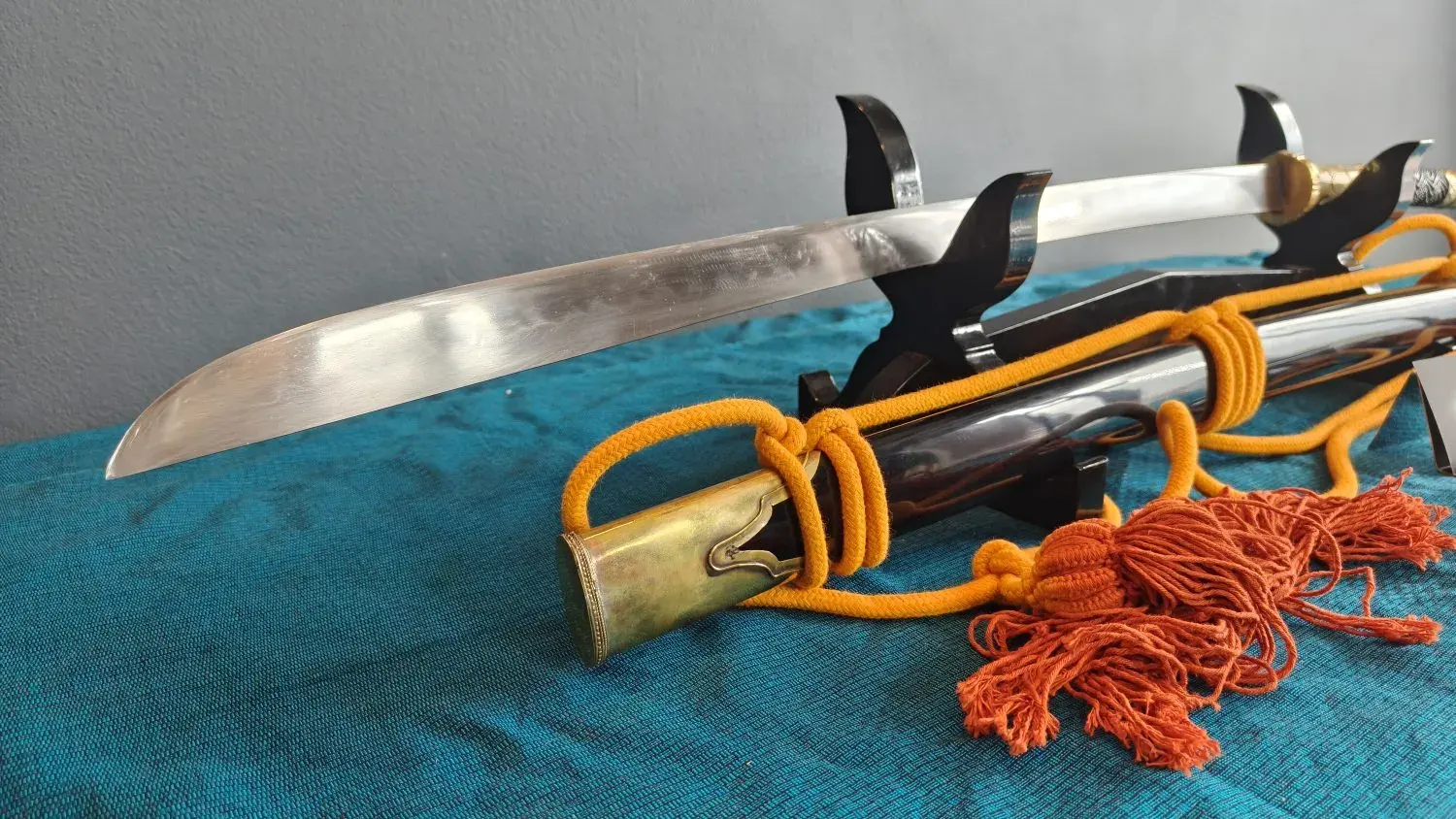 The belly of the blade and the brass chape of the scabbard.