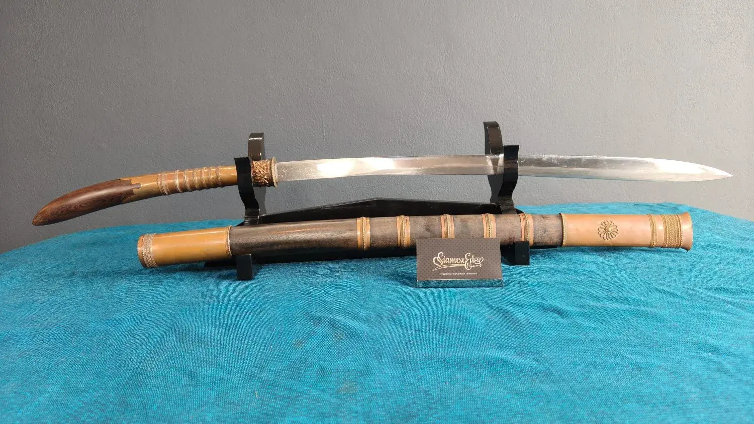 Full side view: the whole sword drawn, hilt at left.