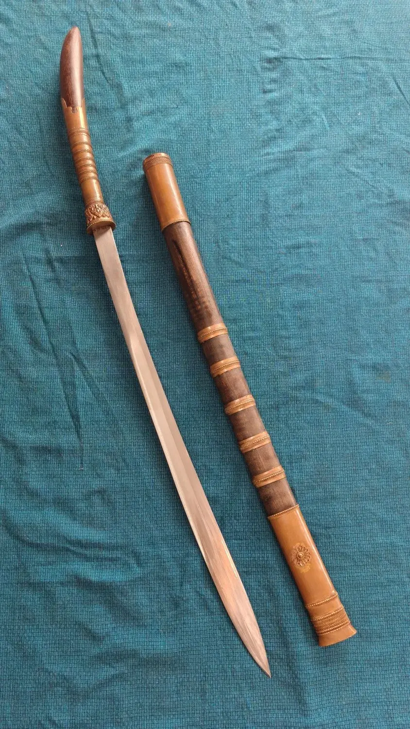 Overhead: sword and scabbard side by side, pestle at the top.