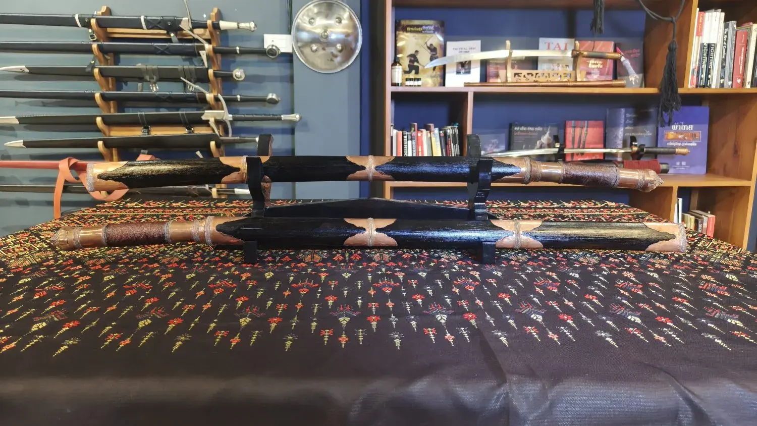 The Tai Dhaab pair sheathed on the stand, side view